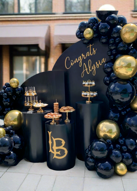 Gold & Black balloon garland with  two backdrops and tables